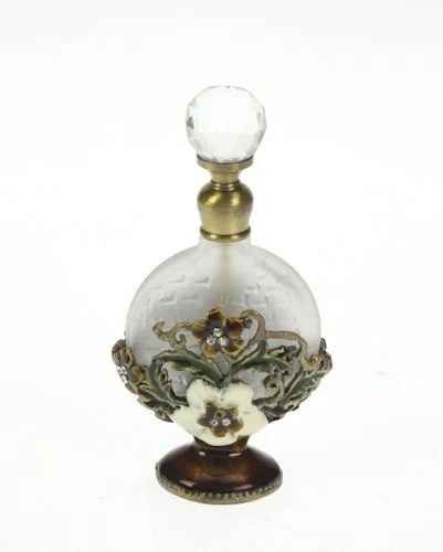 Perfume bottle adorned round cap