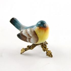 SMALL CERAMIC BIRD ON BRASS BASEMENT